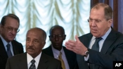 FILE - Russian Foreign Minister Sergey Lavrov, right, welcomes Eritrea’s Foreign Minister Osman Saleh Mohammed, second from left, prior to a meeting in Moscow, Russia, Monday, Jan. 30, 2017. 
