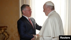 Pope Francis greets Jordan's King Abdullah during a private meeting at the Vatican Dec. 19, 2017. 