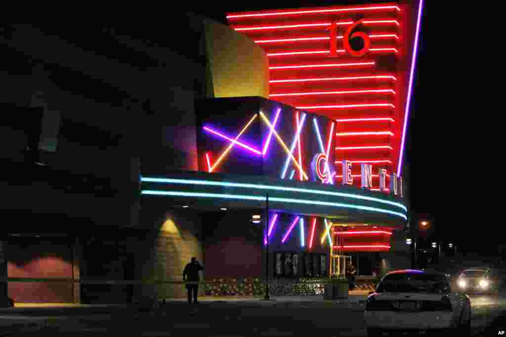 Police outside of Century 16 movie theater where as many as 14 people were killed and many injured at a shooting during the showing of the movie "The Dark Knight Rises" in Aurora, Colorado July 20, 2012.