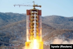 A North Korean long-range rocket is launched into the air at the Sohae rocket launch site, North Korea, in this photo released by Kyodo, Feb. 7, 2016.