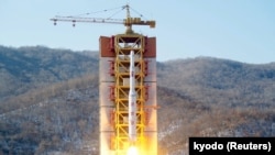 A North Korean long-range rocket is launched into the air at the Sohae rocket launch site, North Korea, in this photo released by Kyodo, Feb. 7, 2016. 