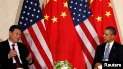 China's President Xi Jinping speaks during his meeting with U.S. President Barack Obama (R), on the sidelines of a nuclear security summit in The Netherlands on March 24 2014.