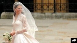 Kate Middleton smiles as she arrives at the West Door of Westminster Abbey in London for her wedding to Britain's Prince William, on April 29, 2011.