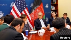 U.S. special envoy for peace in Afghanistan, Zalmay Khalilzad, center, speaks during a roundtable discussion with Afghan media at the U.S Embassy in Kabul, Afghanistan, Jan. 28, 2019. 