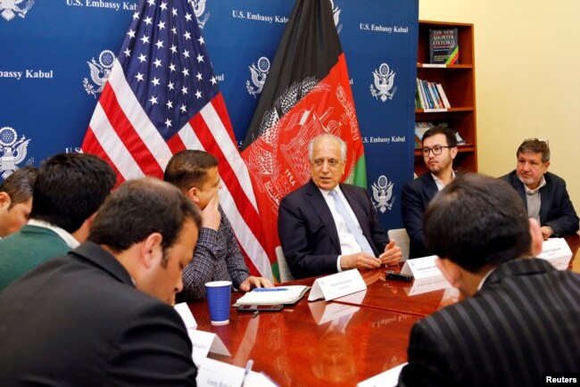 FILE - U.S. special envoy for peace in Afghanistan, Zalmay Khalilzad, center, speaks during a roundtable discussion with Afghan media at the U.S Embassy in Kabul, Afghanistan Jan. 28, 2019.