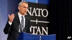 NATO Secretary-General Jens Stoltenberg speaks during a media conference at NATO headquarters in Brussels on April 26, 2018. 