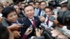 Cambodia's main opposition Cambodia National Rescue Party Acting President Kem Sokha, center, speaks to reporters outside the Phnom Penh Municipality Court in Phnom Penh, Cambodia, Wednesday, April 8, 2015. 