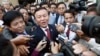 FILE - Cambodia's main opposition Cambodia National Rescue Party Deputy President Kem Sokha, center, speaks to reporters outside the Phnom Penh Municipality Court in Phnom Penh, Cambodia, April 8, 2015. 