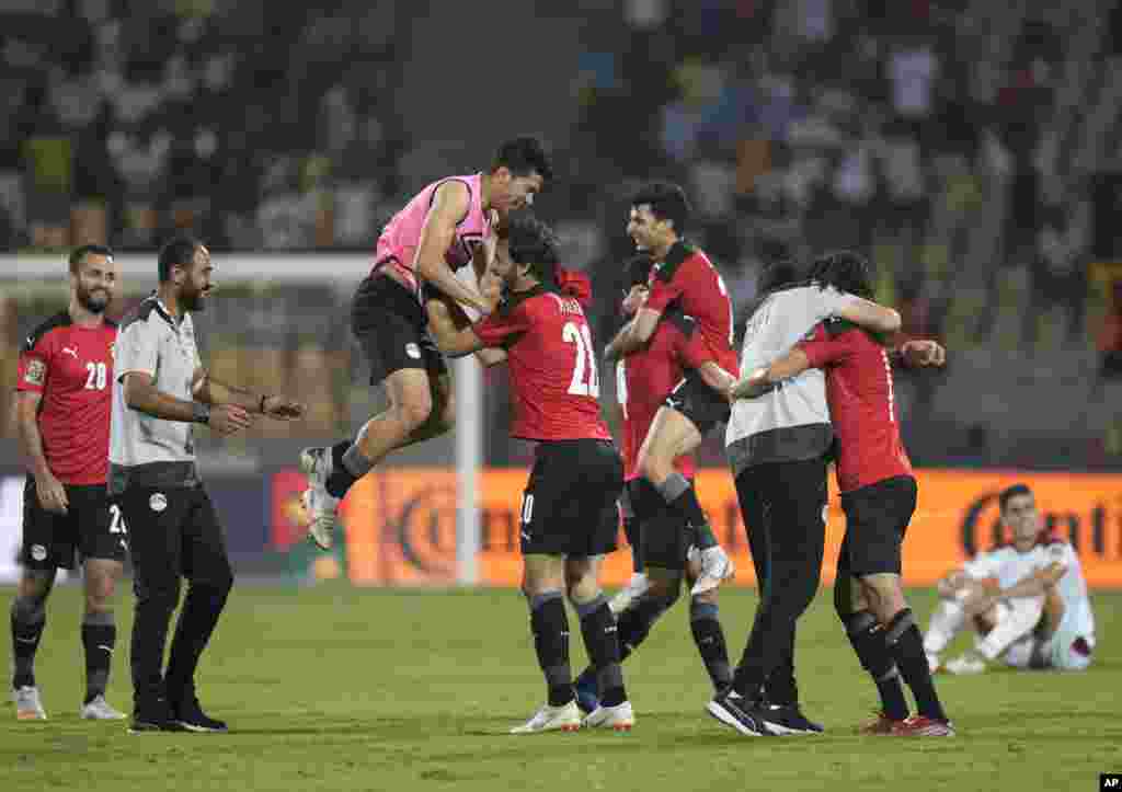 Egypt players celebrate at the end of the game against Morocco in Cameroon, Jan. 30, 2022.