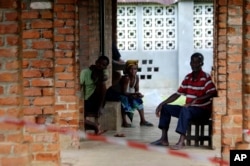 People suspected of having the Ebola virus wait at a treatment center in Bikoro, Democratic Republic of Congo, May 13, 2018.