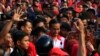 Supporters surround Jakarta governor and presidential candidate Joko Widodo (C) during a PDI-P party campaign in Cilegon, Banten province, March 28, 2014.