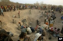 Local miners prospecting for diamonds in Zimbabwe's Marange fields.