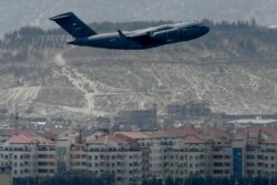An US Air Force aircraft takes off from the airport in Kabul on August 30, 2021.
