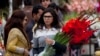 People buy flowers at a flower market, to celebrate Valentine's Day, in Islamabad, Pakistan, Tuesday, Feb. 14, 2017.