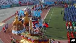 A large parade marks the country's 40th of Victory Over Genocide Day at National Olympic Stadium, in Phnom Penh, Cambodia, Monday, Jan. 7, 2019. 