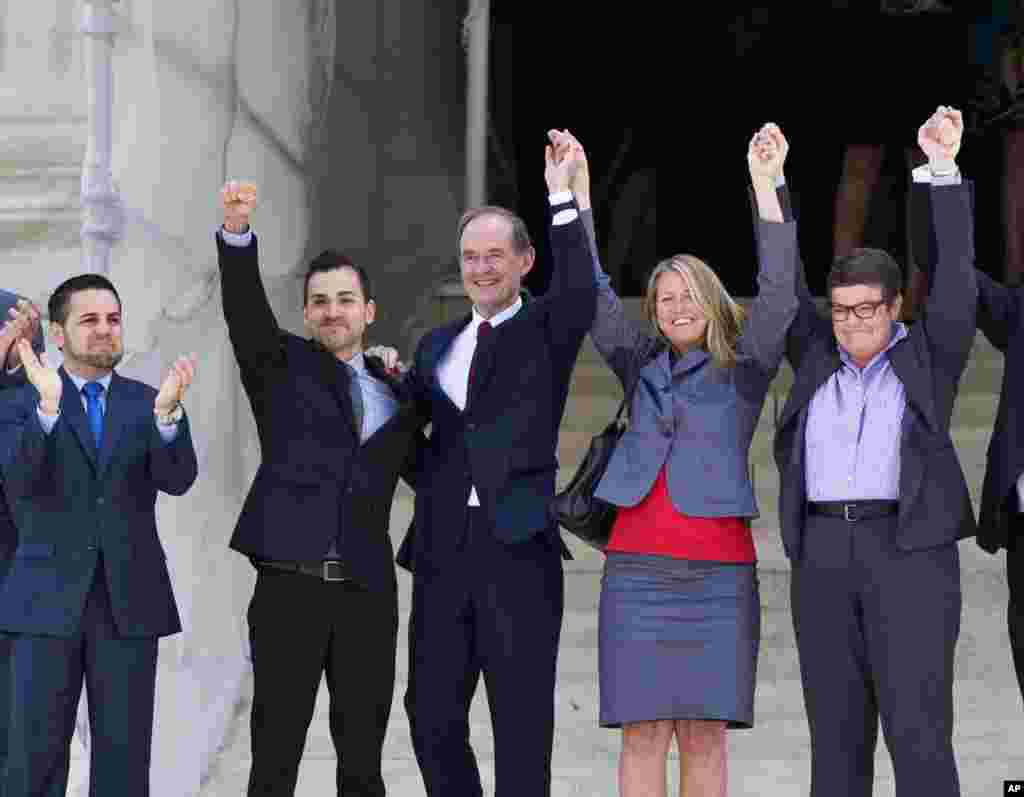 Plaintiffs in Hollingsworth v. Perry, the California Proposition 8 case, react on steps of the Supreme Court in Washington, June 26, 2013, after justices cleared the way for the resumption of same-sex marriage in California. 