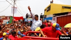 Venezuela's acting president and presidential candidate Nicolas Maduro (C) at a campaign rally in state of Barinas, April 2, 2013.