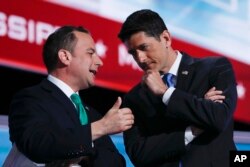 FILE - Speaker Paul Ryan of Wisconsin and Reince Priebus, Chairman of the Republican National Committee, talk at the Republican National Convention in Cleveland, July 19, 2016.
