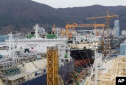 Large liquefied natural gas (LNG) carriers are being constructed at the Daewoo Shipbuilding and Marine Engineering facility in Geoje Island, South Korea, Dec. 7, 2018. South Korea’s big three shipbuilders — Daewoo, Hyundai Heavy Industries and Samsung Heavy Industries — won orders for 53 new LNG carriers in 2018 at about $200 million each.