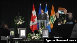 FILE - Canadian Prime Minister Justin Trudeau speaks at a memorial service for the victims of the shootdown of Ukrainian Airlines Flight PS752, at the Saville Community Sports Centre in Edmonton, Alberta, Jan. 12, 2020.