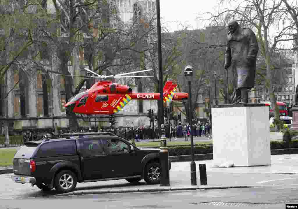 An air ambulance lands in Parliament Square during an incident on Westminster Bridge in London, Britain March 22, 2017. 