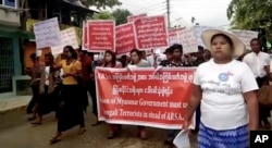 FILE - In this image made from video, protesters march in Sittwe, Myanmar, Oct. 22, 2017. Hundreds of hard-line Buddhists protested to urge Myanmar's government not to repatriate Rohingya Muslims who have fled to Bangladesh.
