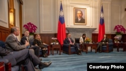 FILE - Taiwan President Tsai Ing-wen, right, meets with a U.S. delegation then in Taiwan for an annual defense forum, May 6, 2019. The Taiwan-US Defense Industry Forum will meet on May 3, 2023, in Taipei, after a pause in the meetings in 2020 because of COVID-19.