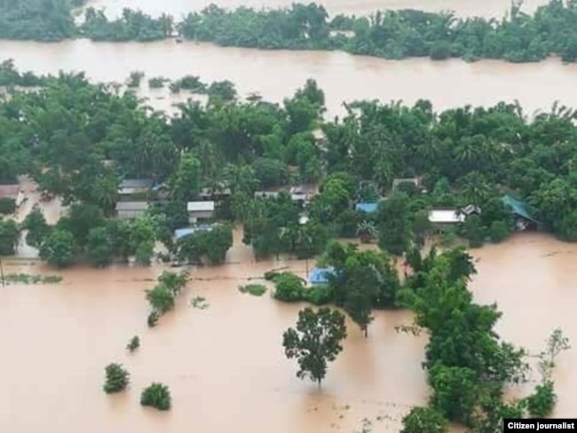 ພາບນໍ້າຖ້ວມໃນແຂວງຄໍາມ່ວນ ທີ່ເຂື່ອນນໍ້າເທີນ 2 ຕັ້ງຢູ່ ໃນປີ 2018