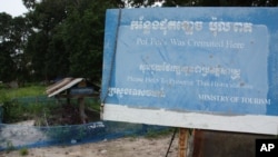 FILE - A marker stands in front of Khmer Rouge leader Pol Pot's grave at Anlong Veng, Cambodia.