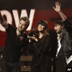 Lady Antebellum, from left, Charles Kelley, Hilary Scott, and Dave Haywood accept the award for best country album at the 53rd annual Grammy Awards, February 13, 2011
