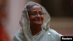 FILE - Prime Minister of Bangladesh Sheikh Hasina arrives to attend The Queen's Dinner during The Commonwealth Heads of Government Meeting, at Buckingham Palace in London, April 19, 2018.