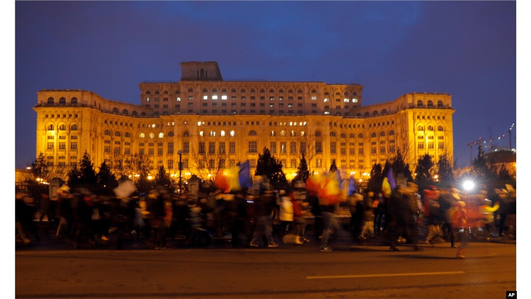 Demonstrators march in front of the government building during a protest in Bucharest, Romania, Feb. 4, 2017. On Saturday, thousands of Romanians took to the streets for a fifth consecutive day to protest a decree that waters down the country's anti-corru