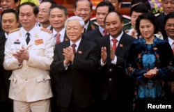 Dàn 'Tứ trụ' mới ngoài ông Trọng và ông Quang (trái), hai vị trí thuộc 'tứ trụ' khác được đề cử là ông Nguyễn Xuân Phúc làm thủ tướng và bà Nguyễn Thị Kim Ngân làm chủ tịch quốc hội.