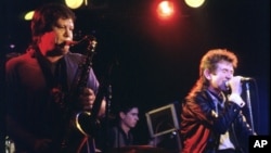 FILE- Bobby Keys on saxophone and bassist Ronnie Lane (R) join The Tremors at the Steamboat, in Austin, Texas, May 1987. 
