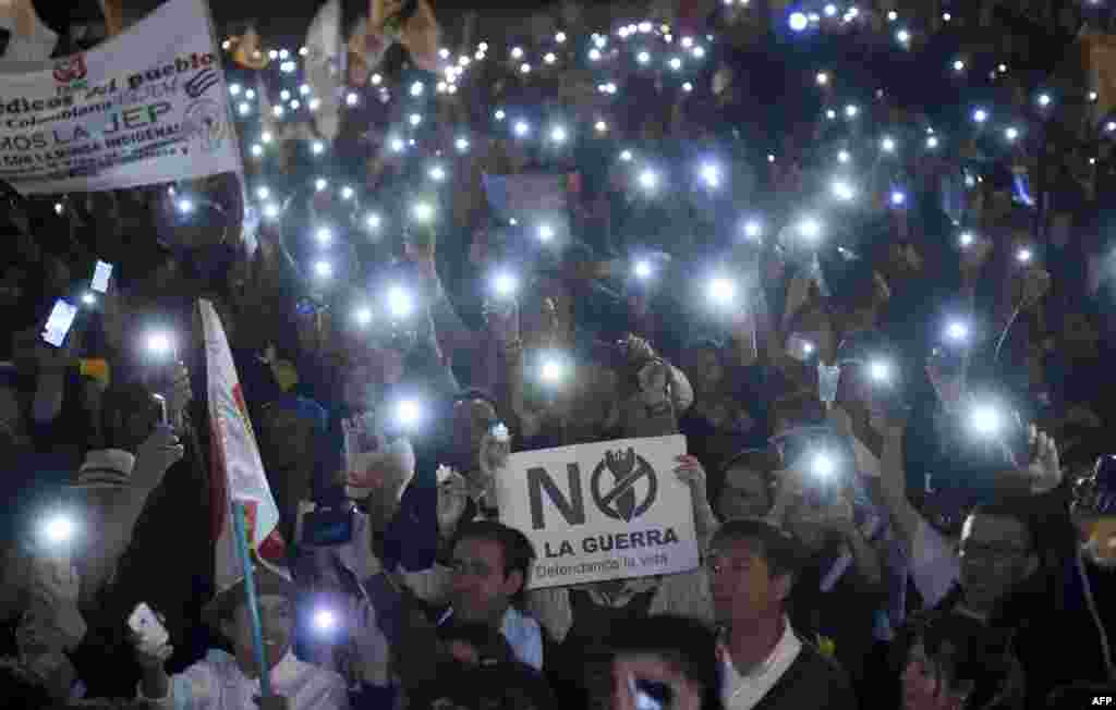 People protest against reform proposed by the government for the Special Jurisdiction for Peace (JEP) with a sign reading &quot;No to war&quot; in Bogota, Colombia, on March 18, 2019.
