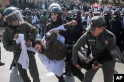 Security forces detain a protesting teacher during a demonstration in Rabat, Morocco, Feb. 20, 2019.