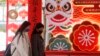 People walk past tiger decorations for the upcoming Chinese Lunar New Year, the Year of the Tiger according to the Chinese zodiac, in Taipei, Jan. 28, 2022.
