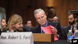 FILE - Robert Ford, then the U.S. ambassador to Syria, arrives to testify to the Senate Foreign Relations Committee about the conflict in Syria, on Capitol Hill in Washington, Oct. 31, 2013.