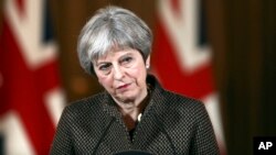 Britain's Prime Minister Theresa May during a press conference in 10 Downing Street, London, April 14, 2018. May says the need to act quickly and protect “operational security” led her to strike Syria without a prior vote in Parliament. 