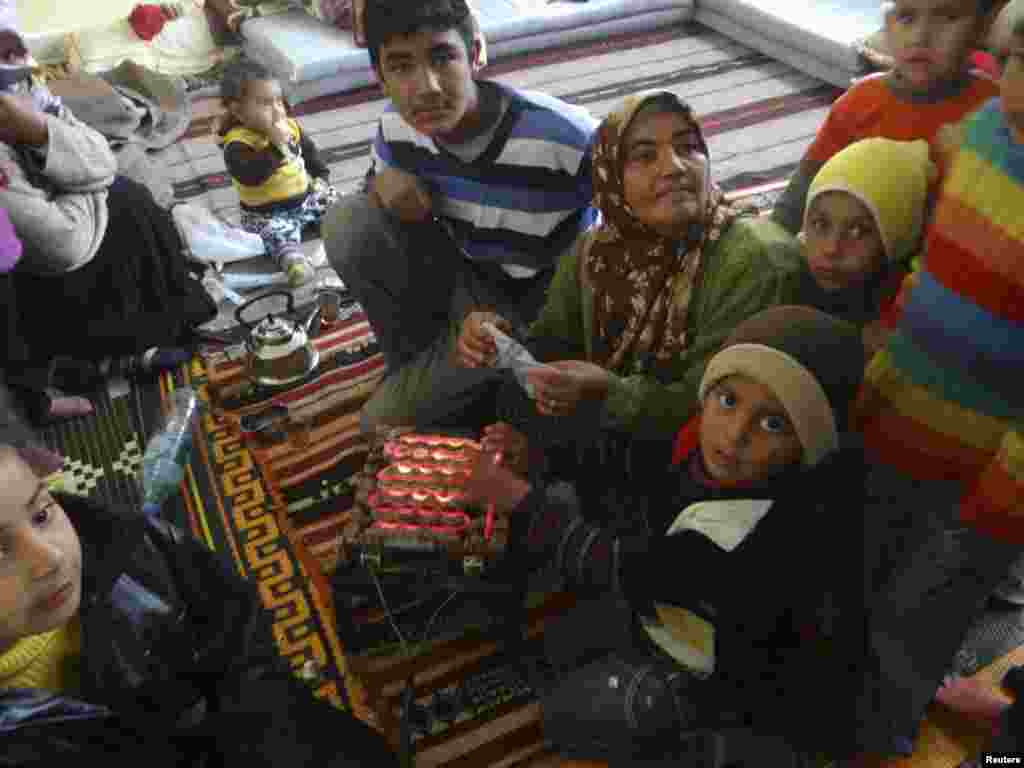 Syrian refugees fleeing violence in their towns are seen at their temporary home in a school at Tel Abyed near Hasaka December 17, 2012. Picture taken December 17.