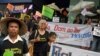 FILE - Thai villagers hold banners opposing the building of a dam on the Mekong river during a rally outside a construction company in Bangkok, Thailand Tuesday, April 24, 2012.