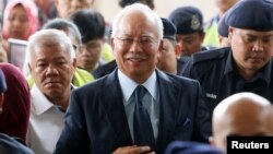 Malaysia's former Prime Minister Najib Razak arrives in court in Kuala Lumpur, Malaysia, Oct. 4, 2018.