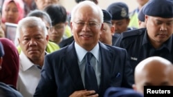 Malaysia's former Prime Minister Najib Razak arrives in court in Kuala Lumpur, Malaysia, Oct. 4, 2018.