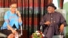Nigerian President Goodluck Jonathan (R) speaks, flanked by broadcaster and publisher Adesuwa Onyenokwe, during a nationally broadcast interview with journalists in Abuja, Nigeria, Feb. 11, 2015.