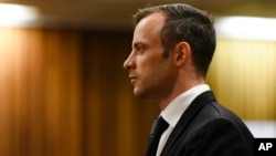 Oscar Pistorius pauses in the dock at the High Court in Pretoria, South Africa, Dec. 8, 2015.