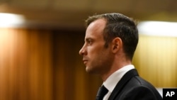 Oscar Pistorius pauses in the dock at the High Court in Pretoria, South Africa, Tuesday Dec. 8, 2015.