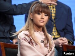 FILE - Ariana Grande answers questions during the panel for "Hairspray Live!" at the NBC Universal Television Critics Association press tour in Beverly Hills, California.