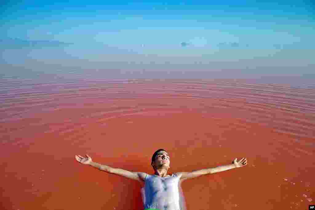 An Iranian man swims in Urmia Lake near Urmia, northwestern Iran.