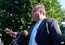 New Jersey Gov. Chris Christie speaks to members of the media outside the West Wing of the White House in Washington after attending President Donald Trump speaking on the opioid crisis, Oct. 26, 2017.