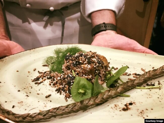 Sean Sherman prepared this modern version of a traditional Lakota dish, Wasna, made with duck, popped wild rice and amaranth, foraged fennel and miners lettuce at the 20th annual World of Flavors at the Culinary Institute of America, St. Helena, Ca.